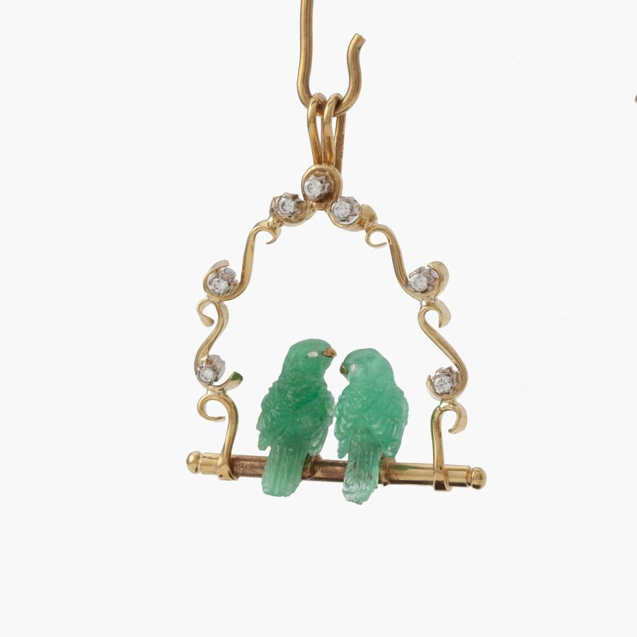 Gübelin hanger met twee vogels van smaragd met bijpassende staander