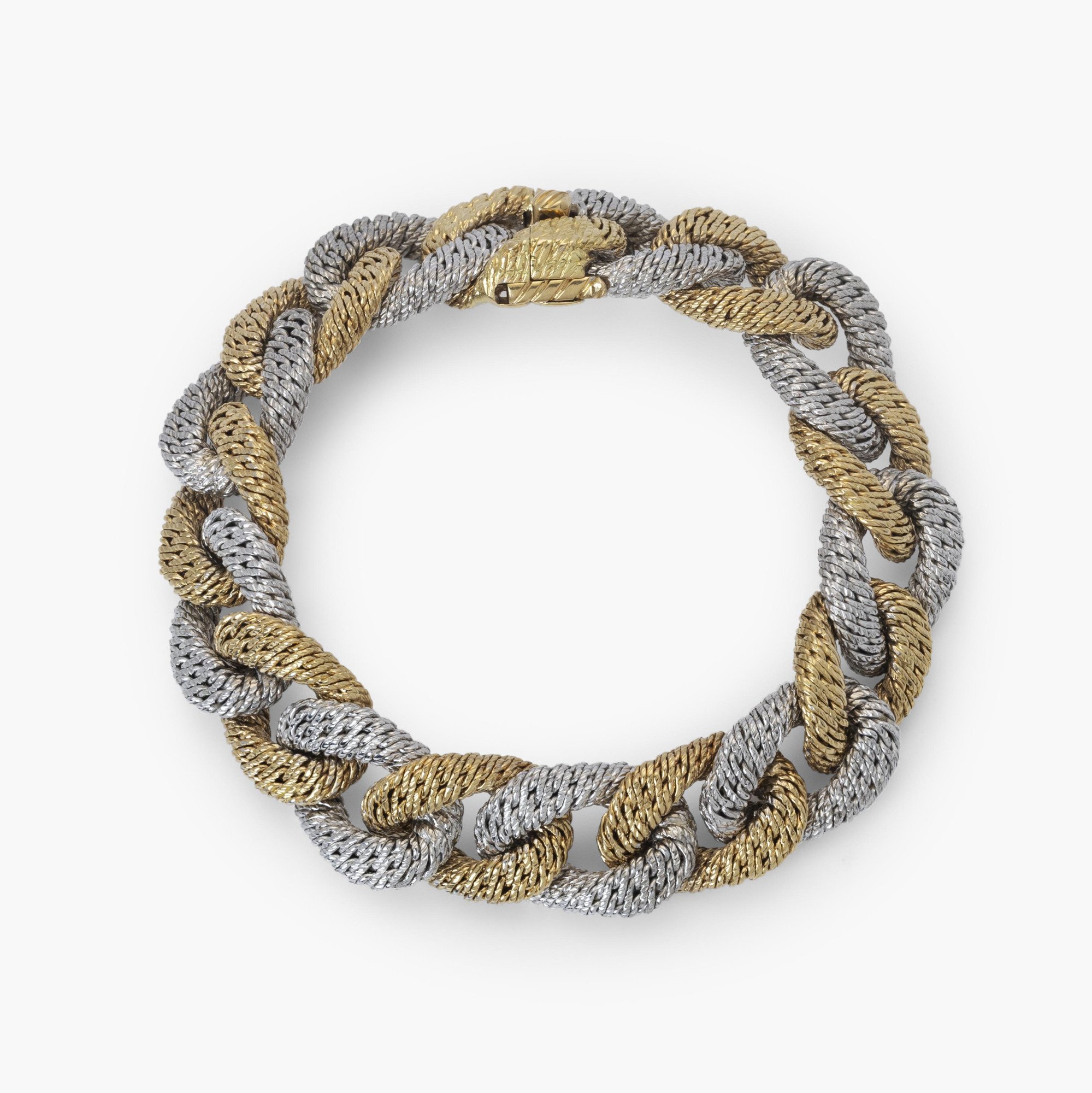 Een achttien karaat wit- en geelgouden gourmet schakelarmband. Met meesterteken van Georges Lenfant, Parijs. Vervaardigd omstreeks 1970.