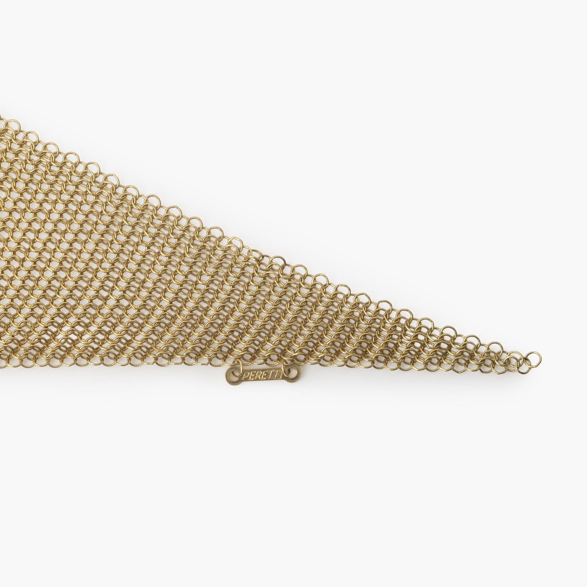 Een achttien karaat geelgouden collier in de vorm van een sjaal, gesigneerd Elsa Peretti voor Tiffany & Co., vervaardigd in de USA, circa 1980.